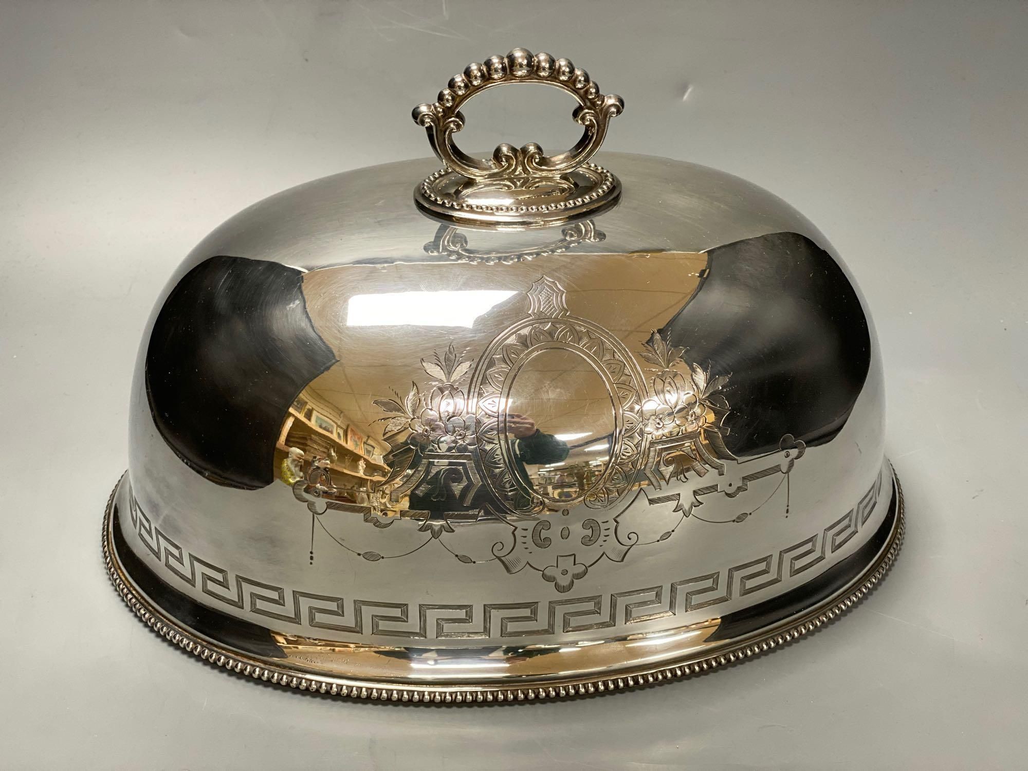 A silver plated engraved meat dome, width 33cm